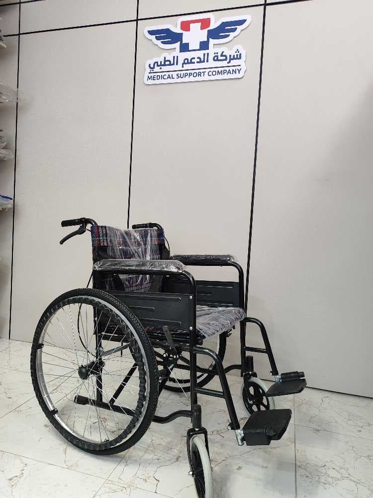 كرسي متحرك يدوي حديد وقماش مدعم