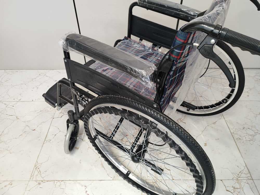 كرسي متحرك يدوي حديد وقماش مدعم